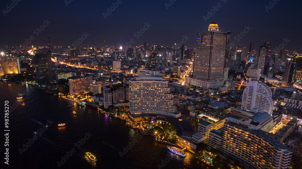 aerial night scene of bangkok sky scraper beside chaopraya river