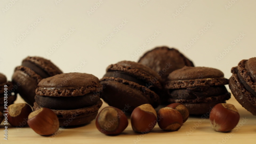 Tasty chocolate Macaroons on wooden table Tasty chocolate Macaroons on wooden table