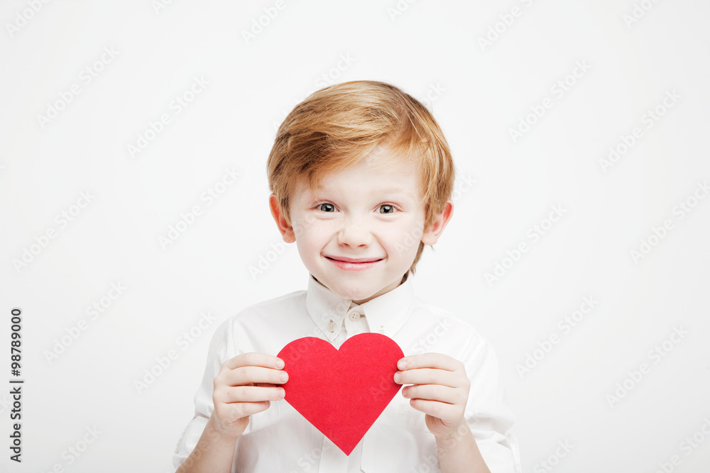 cute little boy with a red heart in the hands cute little boy with a red heart in the hands