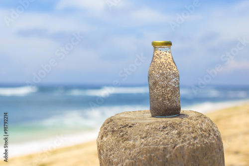 Chia in fresh coconut water with beach in background