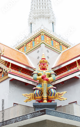 Red Thai giant demon Yaksha statue at  at Wat Phutthaisawan temple in Ayutthaya Thailand.