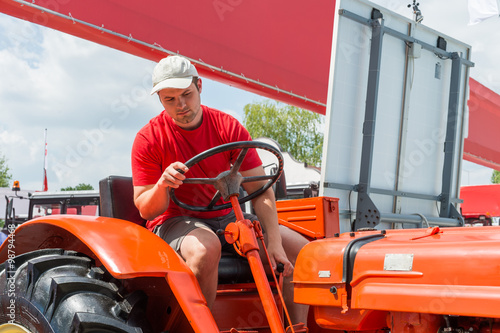 Young farmer in tractor