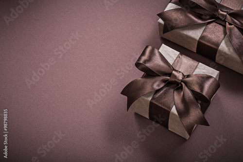 Birthday gift boxes on brown background holidays concept