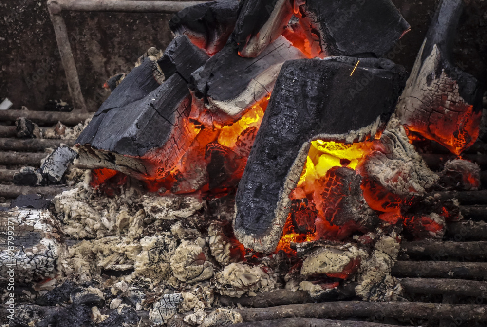 A fire flamed in an open fireplace A fire flamed in an open fireplace