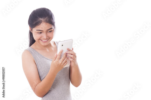 Portrait of young woman using tablet pc on white background