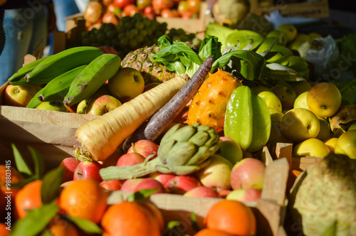 Mixed fruits and vegetables on market stall