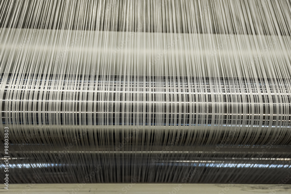 Yarn warping machine in a textile weaving factory Yarn warping machine in a textile weaving factory