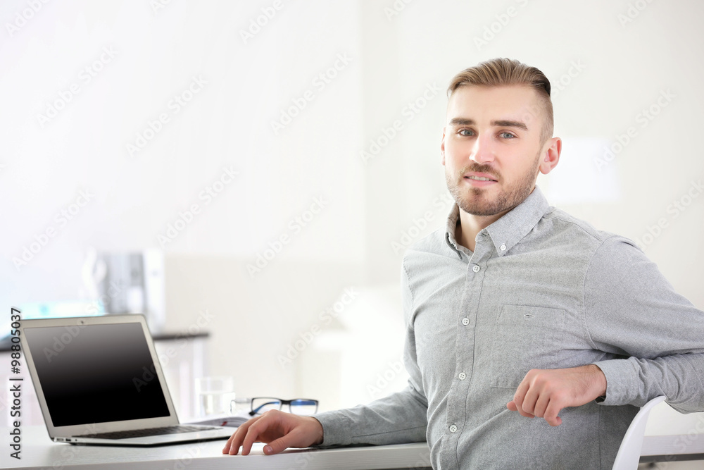 Businessman working with laptop in office Businessman working with laptop in office