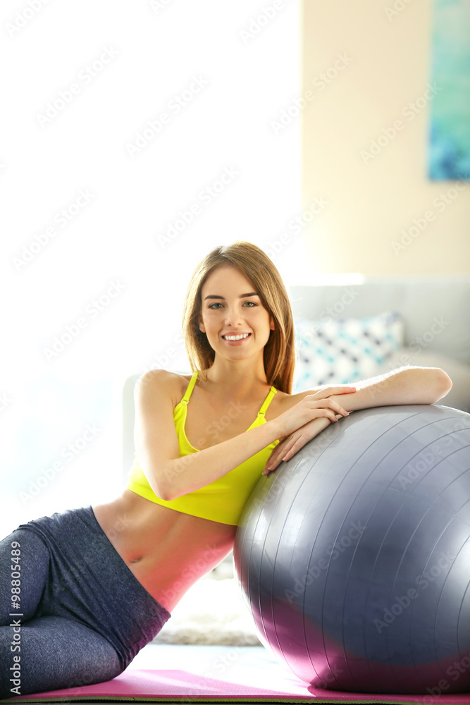 Beautiful young girl with fit ball at home Beautiful young girl with fit ball at home