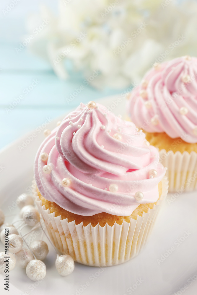 Pink cupcakes on wooden background Pink cupcakes on wooden background
