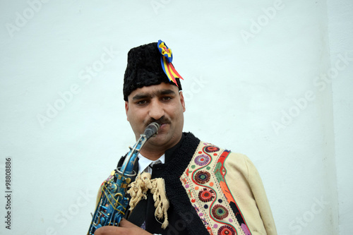 Gipsy singing traditional Romanian carols at saxophone.