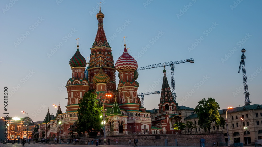 Time-lapse. Saint Basil Cathedral on Red Square, Moscow at night. One of the most popular landmark in Russia. The building is shaped as a flame of a bonfire rising into the sky. Blurred people Time-lapse. Saint Basil Cathedral on Red Square, Moscow at night. One of the most popular landmark in Russia. The building is shaped as a flame of a bonfire rising into the sky. Blurred people