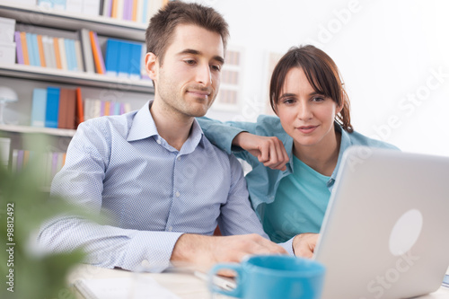 Young couple using internet services