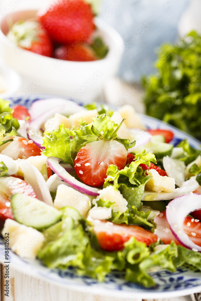 Strawberry salad with cucumber, red onion and parmesan cheese Strawberry salad with cucumber, red onion and parmesan cheese
