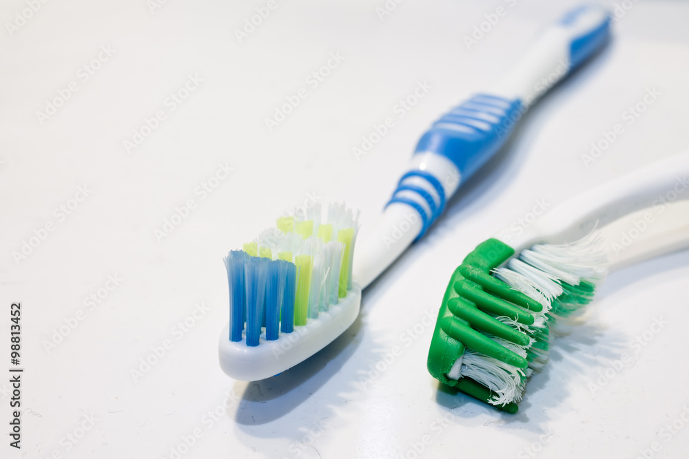 old and new toothbrushes close up isolated old and new toothbrushes close up isolated