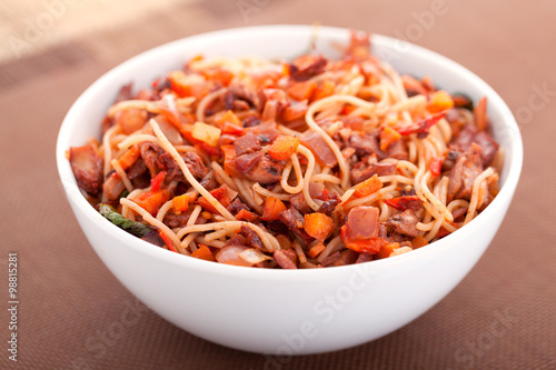 Spaghetti with rabbit and tomatos