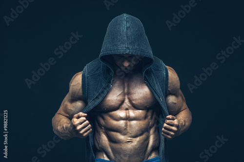 Man with muscular torso. Strong Athletic Men Fitness Model Torso showing six pack abs