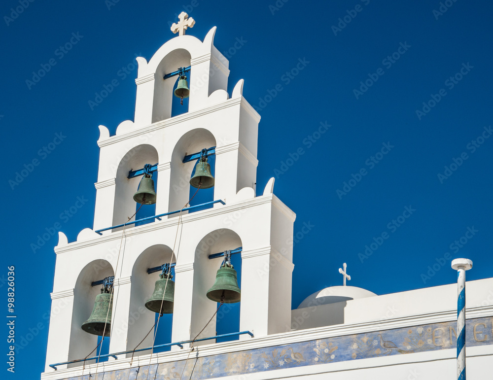 A bell tower at a Greek Orthodox church in Oia town on the island of Santorini, Greece