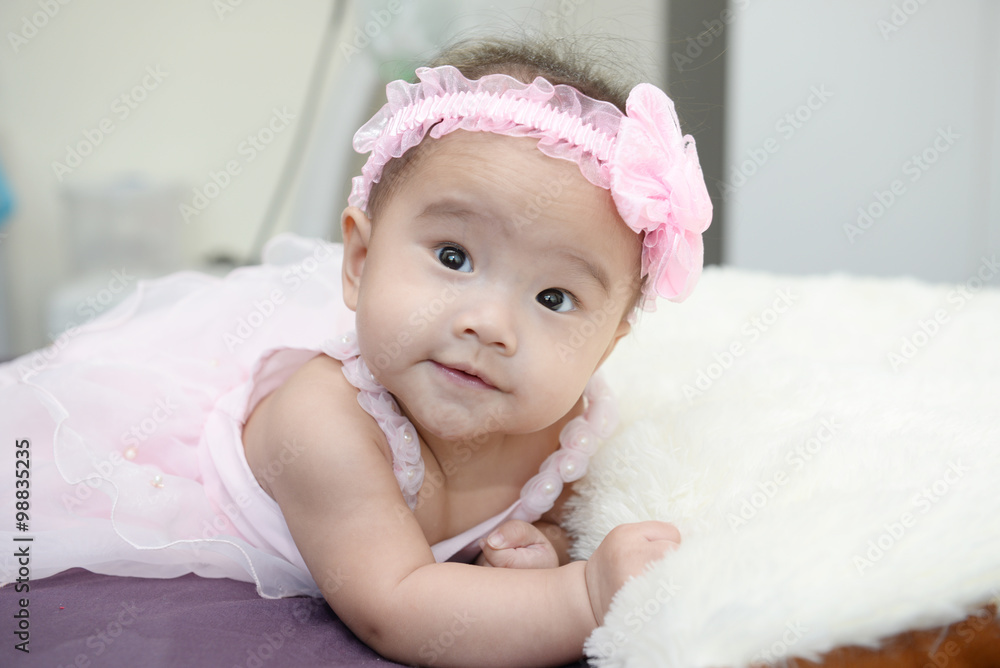 Baby sitting on a soft cloth in the living room Baby sitting on a soft cloth in the living room
