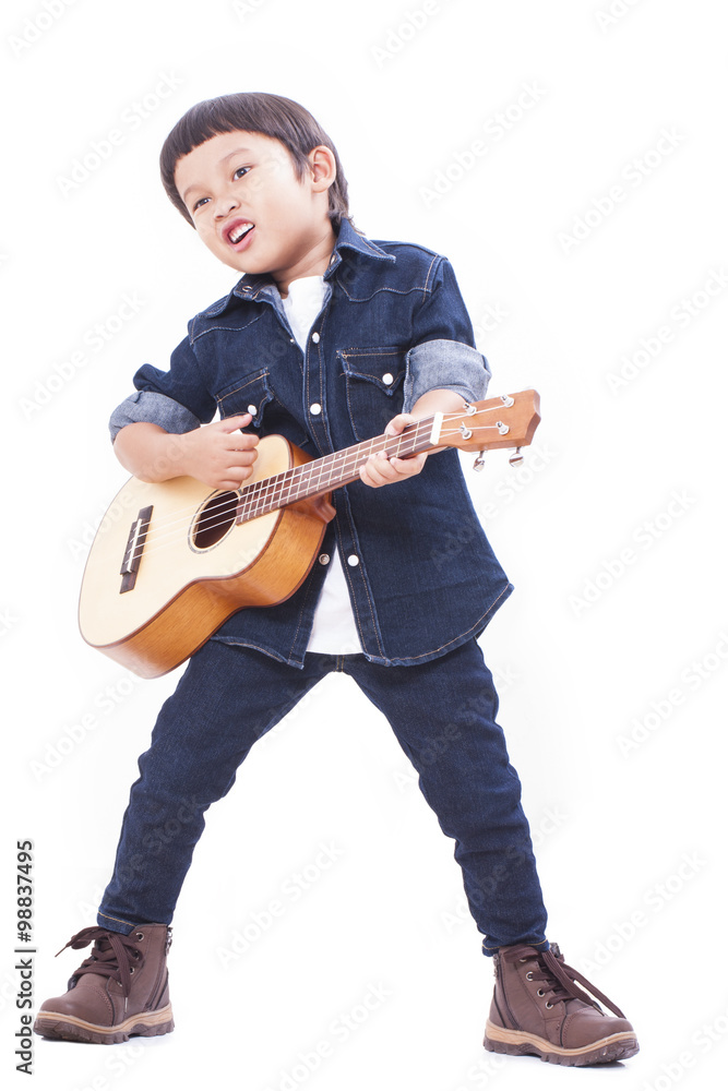 Cute boy playing the ukulele on white background Cute boy playing the ukulele on white background