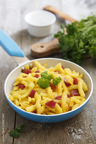 Fresh spaetzle pasta with cheese and bacon photo