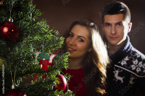 Young couple with Christmas tree © zsirosistvan
