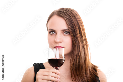 Beautiful young woman holding a glass of wine © Mendelex