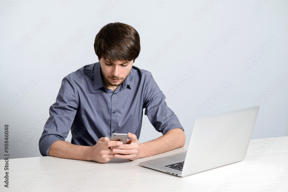 Young man working at laptop Young man working at laptop
