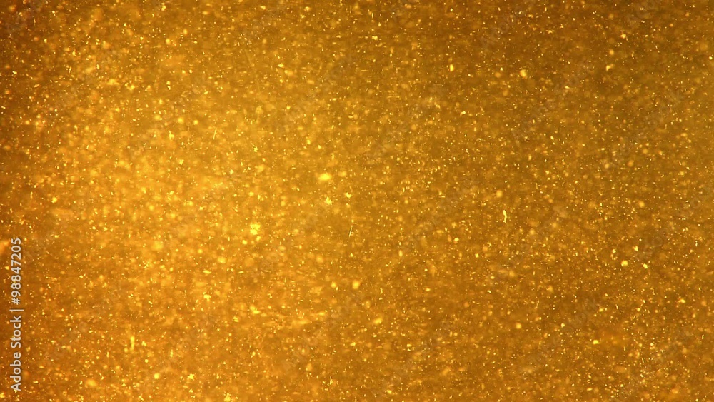 Bright Particles Flowing in Dark Yellow Liquid Bright Particles Flowing in Dark Yellow Liquid