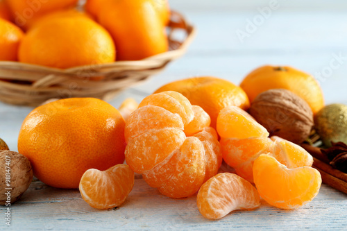 Ripe mandarins on a blue wooden table