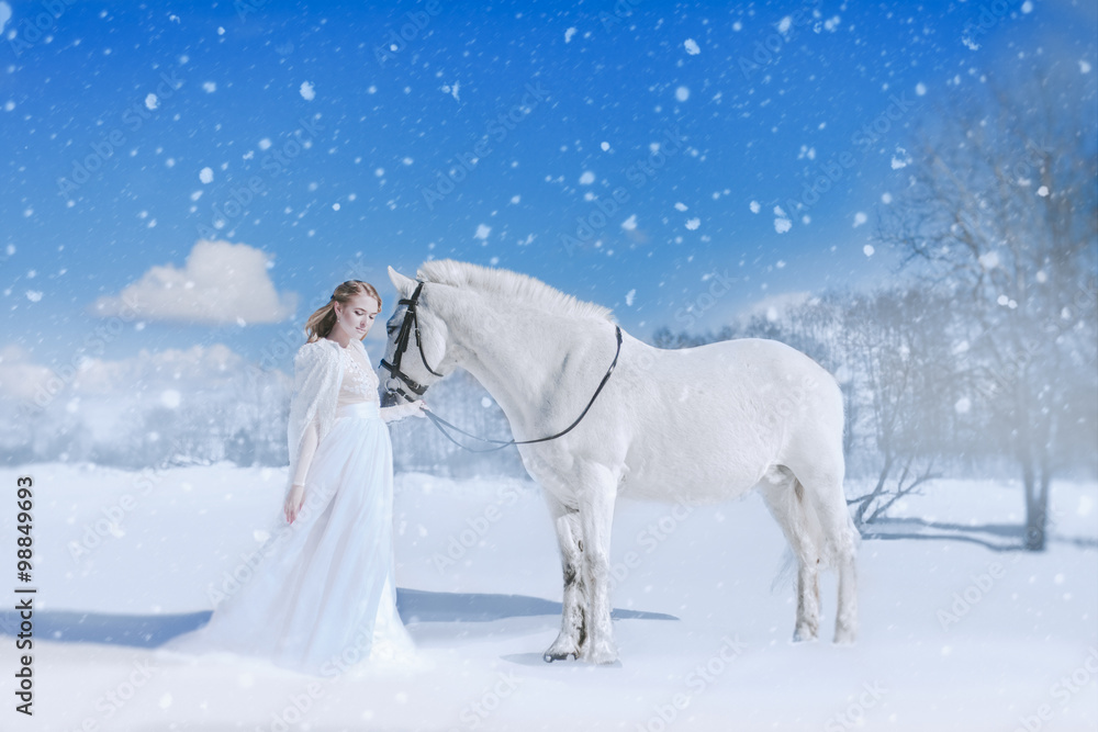 Winter fairytale bride and white horse in snowfall