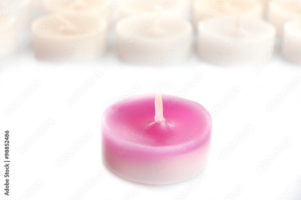 Pink and white small candles, isolated on white Pink and white small candles, isolated on white