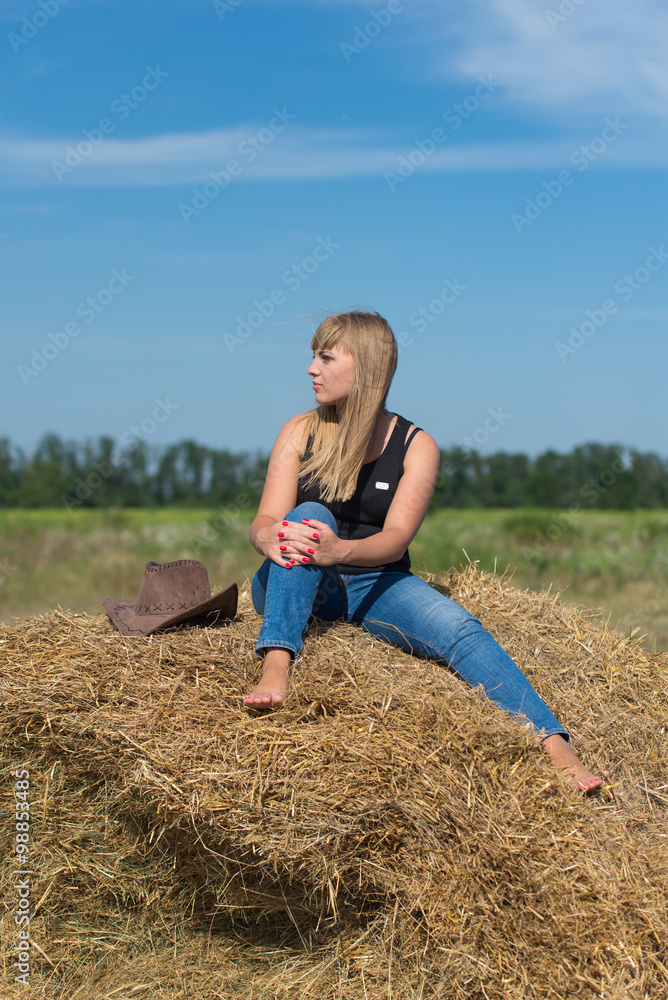 Pretty young girl on a haystack Pretty young girl on a haystack