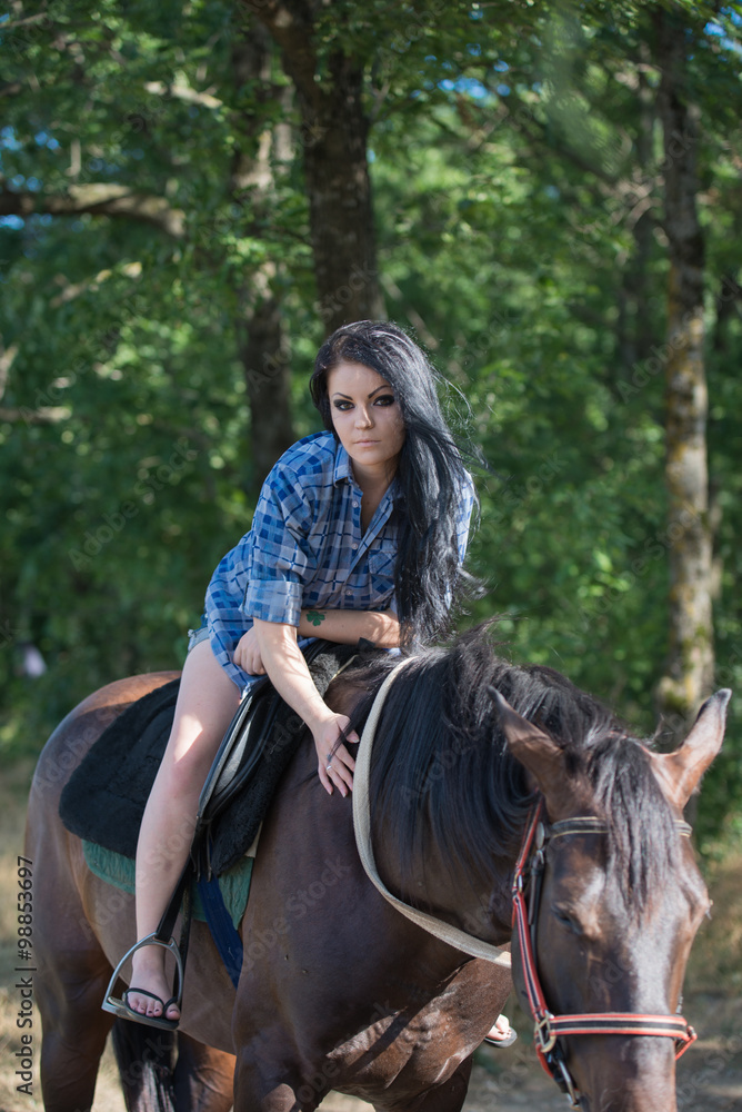 Young beautiful girl with a horse on nature Young beautiful girl with a horse on nature