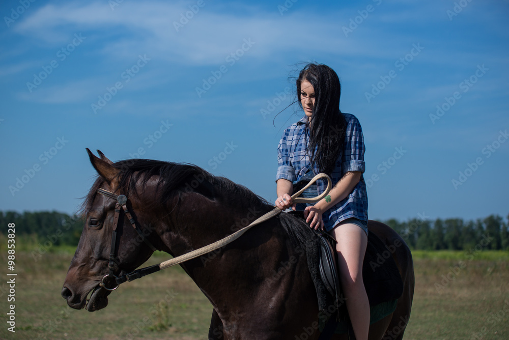Young beautiful girl with a horse on nature