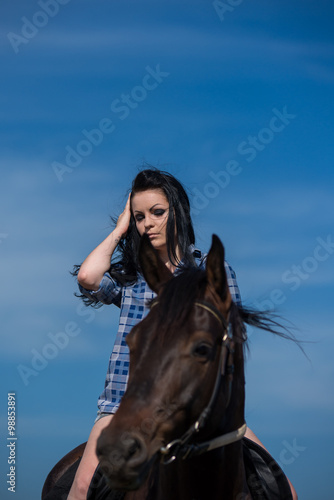 Young beautiful girl with a horse on nature © Solomkina Viktoria