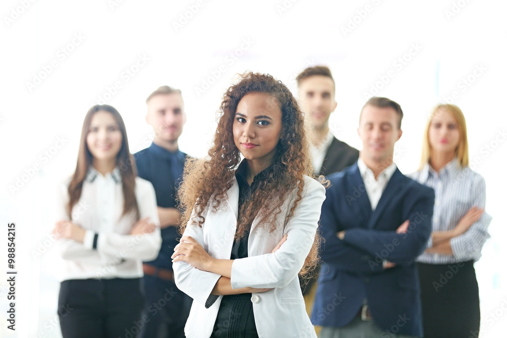 Photo of young business people in a conference room Photo of young business people in a conference room