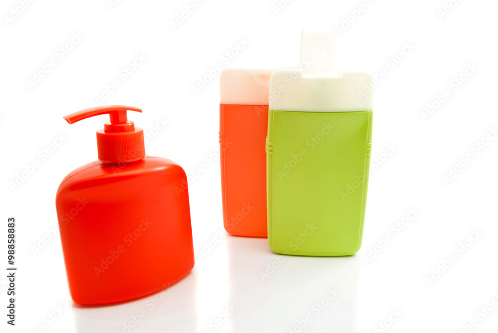three colored bottles with shower gel three colored bottles with shower gel
