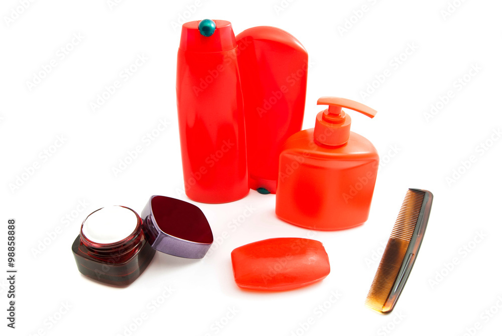 Obraz premium hairbrush, red soap and other toiletry