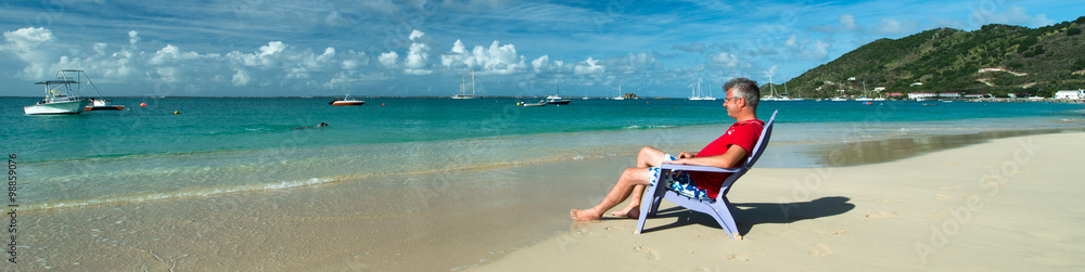 Man is relaxing in a Caribbean beach