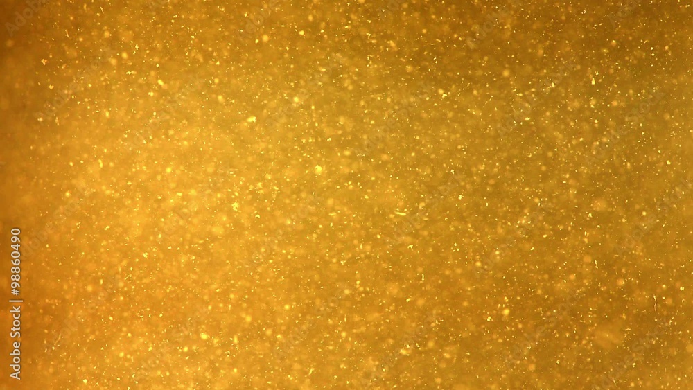 Bright Particles Flowing in Dark Yellow Liquid Bright Particles Flowing in Dark Yellow Liquid