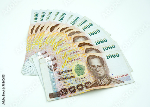 Pile of Thai money on white