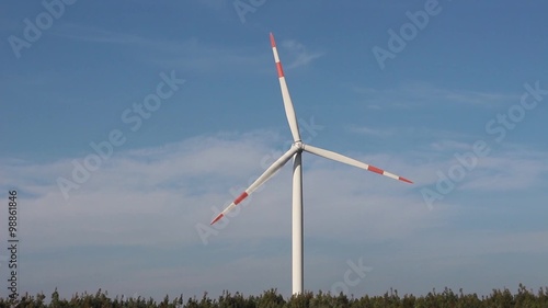 Wind turbine, vegetation, blue sky