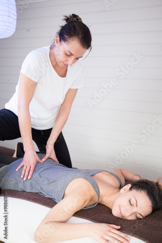 Woman having a back Shiatsu massage