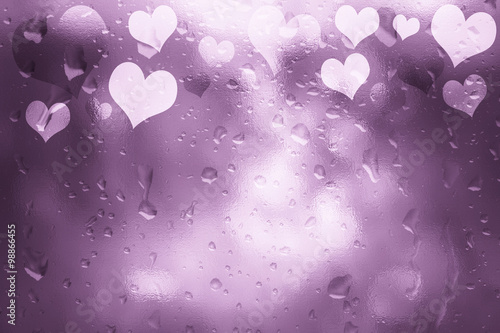 Glass textured shiny pink color Valentine's Day Heart shapes illustration background with droplet. Lovely textured Valentine Holidays greeting card copy space background.