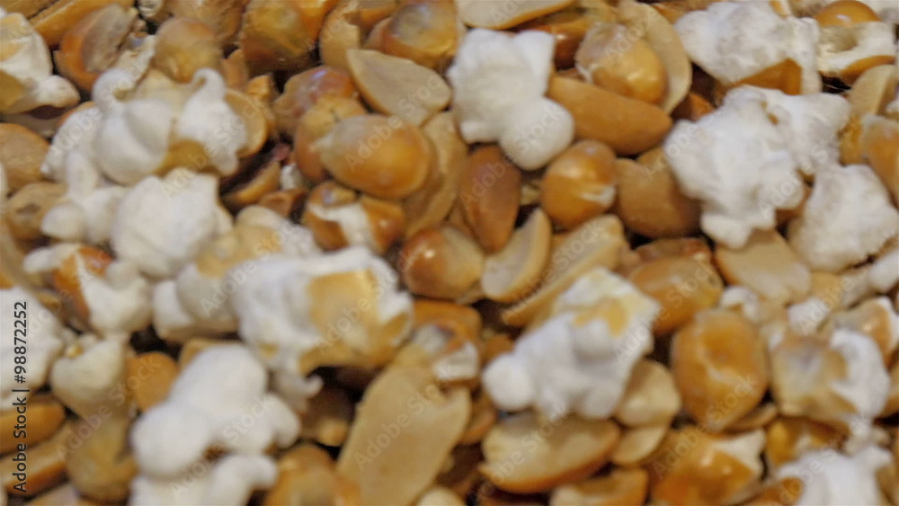 Popcorns with nuts for sale in the expo in Milan. The white popcorn and the brown nuts are available on the expo event in Italy Popcorns with nuts for sale in the expo in Milan. The white popcorn and the brown nuts are available on the expo event in Italy