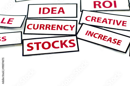 business motivation word  IDEA, ROI, CURRENCY, CREATIVE, STOCKS and INCREASE printed on paper with red color isolated on white background