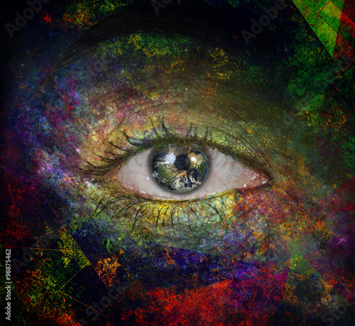 Girls eye with paint and earth photo