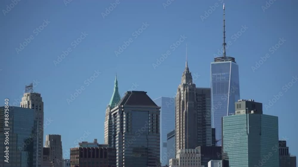 New York City skyline from the harbor on a clear, sunny day. New York City skyline from the harbor on a clear, sunny day.