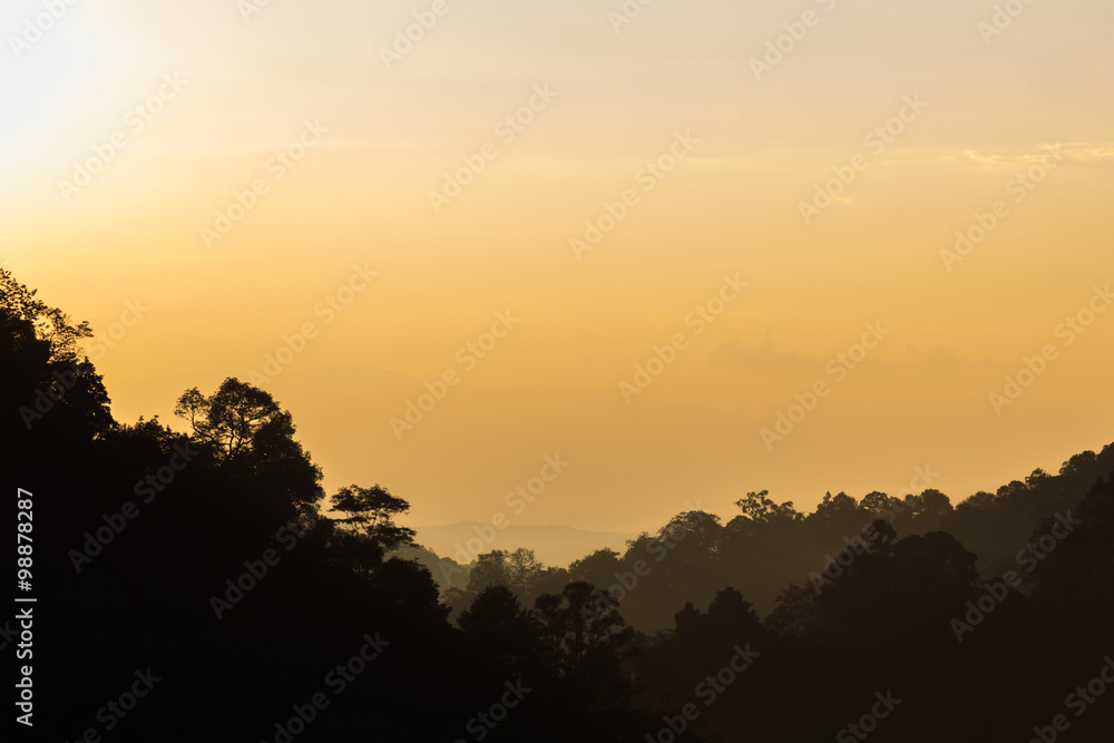 Silhouette of mountains at the dawn time as background